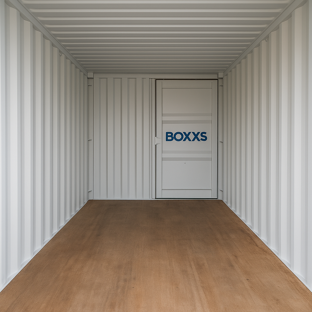 A spotless, well-lit interior of a 20ft Boxxs-branded storage container showing a clean, dry, empty space ready for use