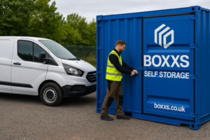 A tradesperson’s van parked outside a Boxxs Self Storage container used for storing tools and materials