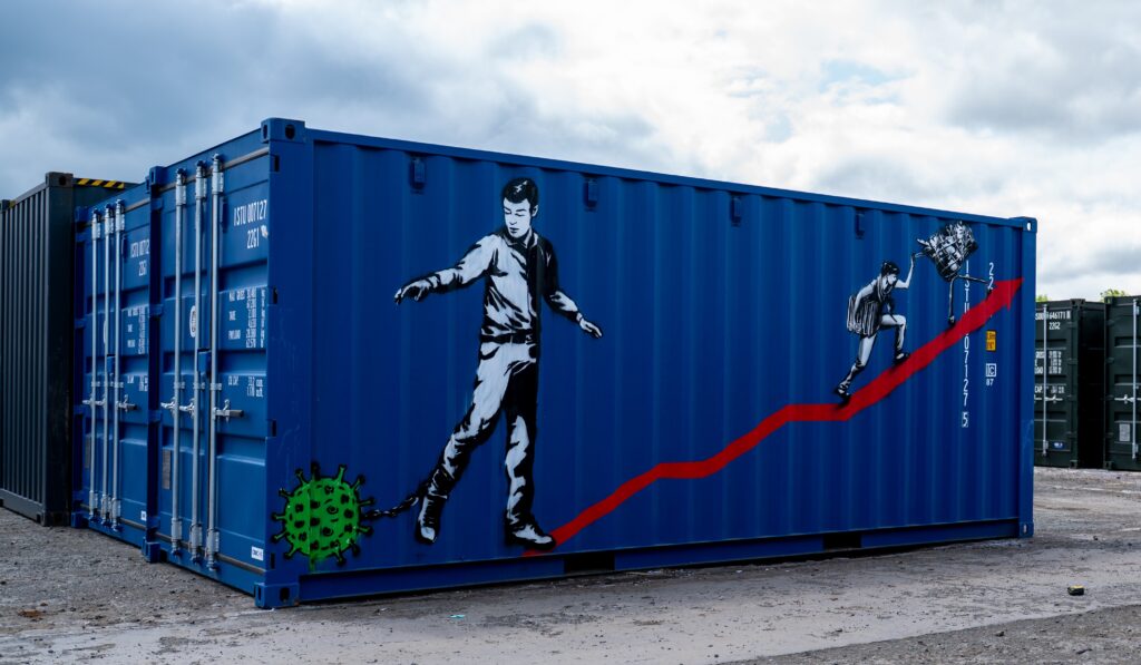 Rebel Bear’s mural on a bright blue BOXXS Self Storage container at Linlithgow