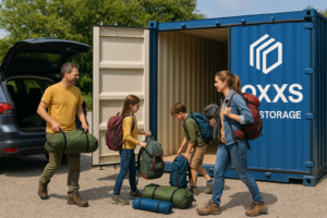 Family unloading hiking equipment into a gentian blue Boxxs storage container in Linlithgow, West Lothian.