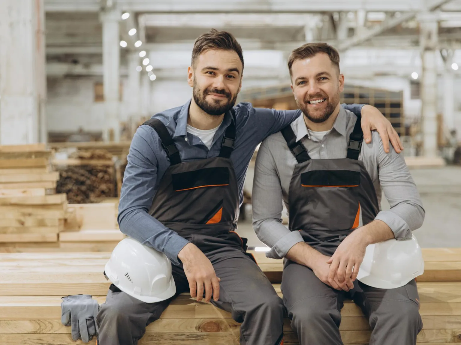 Storage for tradespeople in West Lothian, two tradesmen sitting with tools and materials in a workshop environment